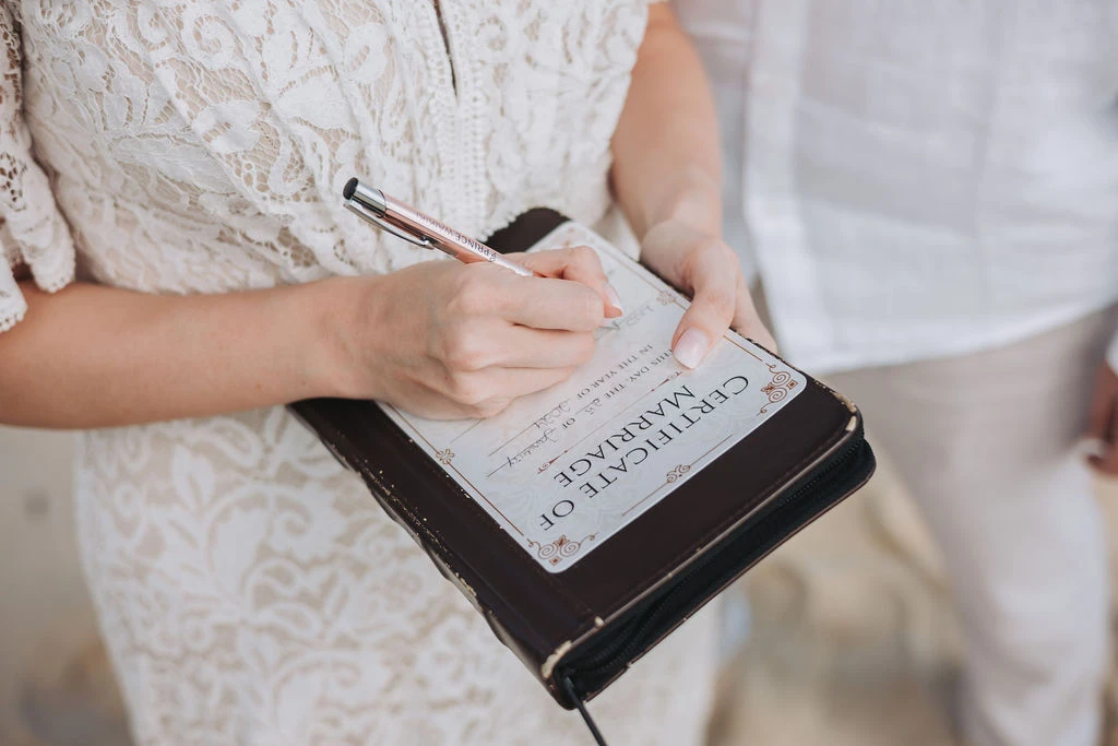 Signing marriage certificate