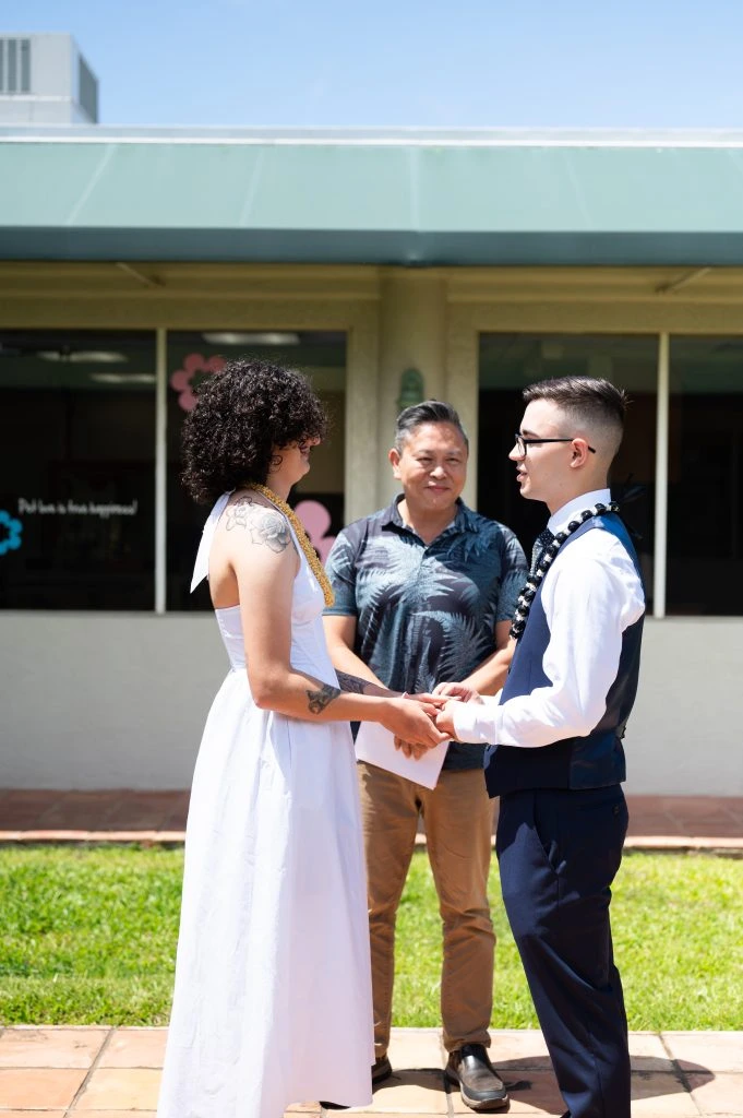 Couple exchanging vows outdoors