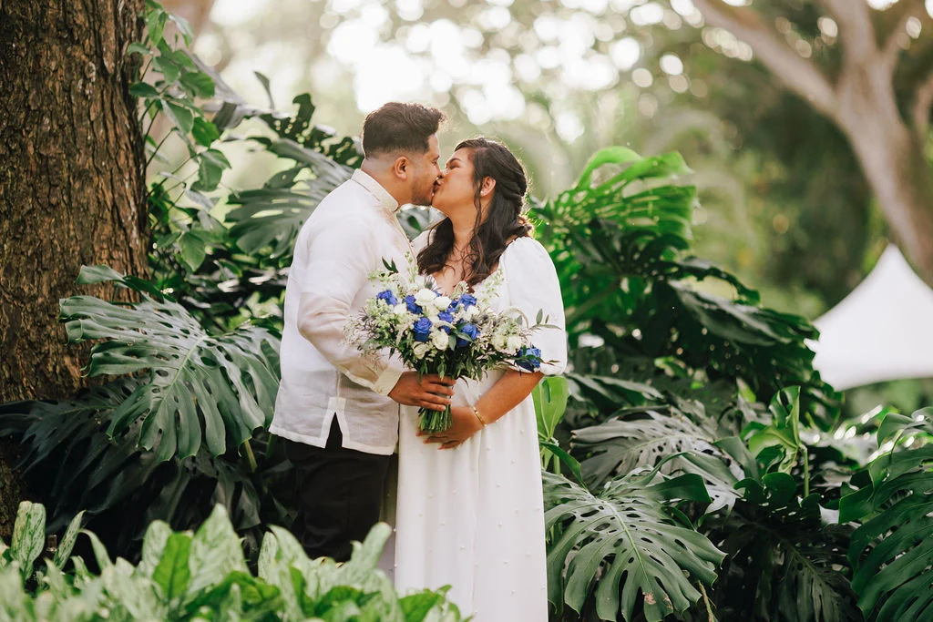 Couple kissing in a garden