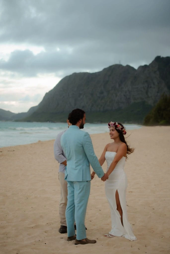 Couple exchanging vows on the beach