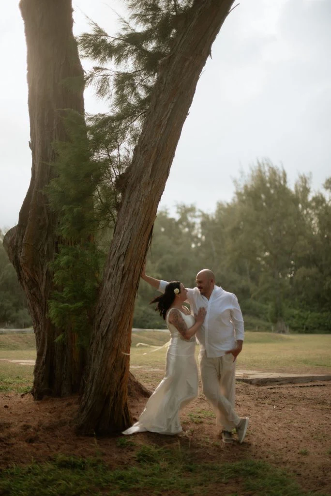 Couple sharing a romantic moment by a tree