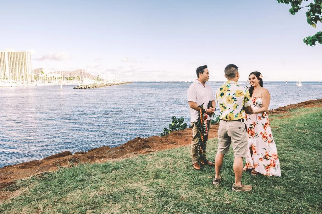 Couple exchanging vows by the waterfront