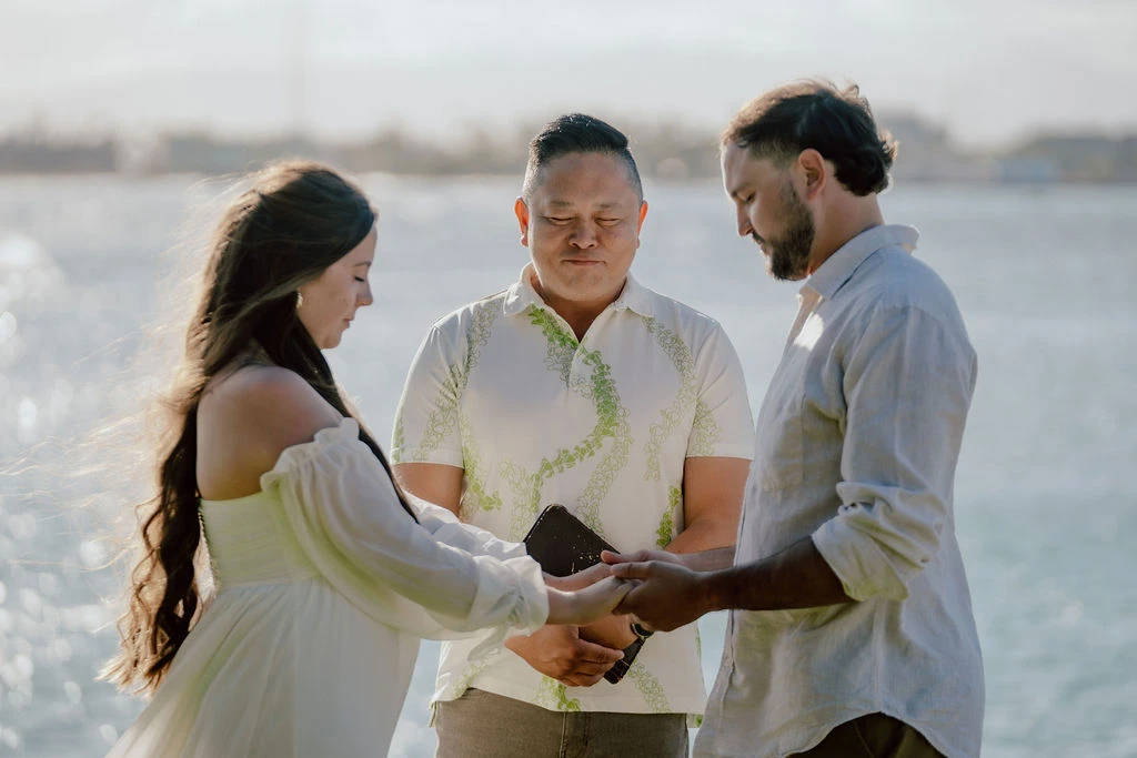 Romantic seaside vow exchange