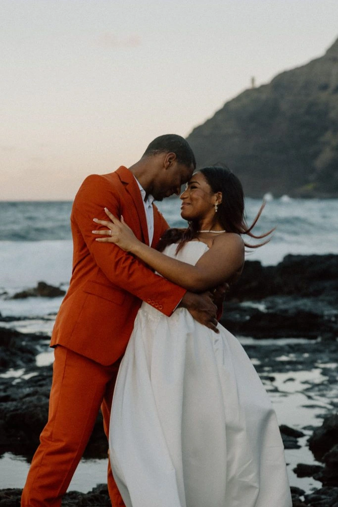 Couple embracing by the ocean