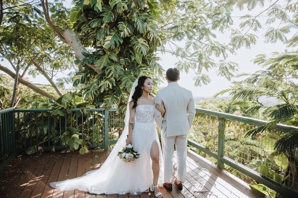 Bride and groom on a wooden deck