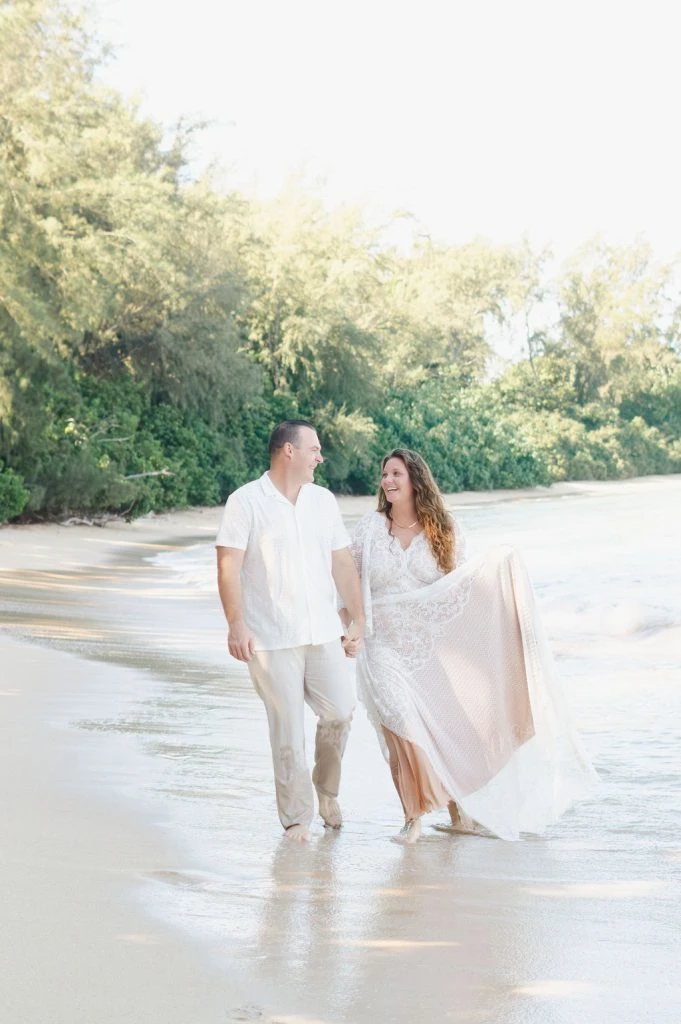 Couple waking on the beach