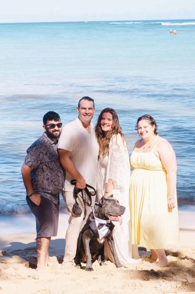 Group photo on the beach with a dog