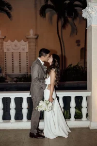 Couple kissing after their wedding