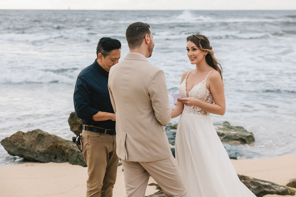Reverend James Chun officiating a destination wedding on an Oahu beach