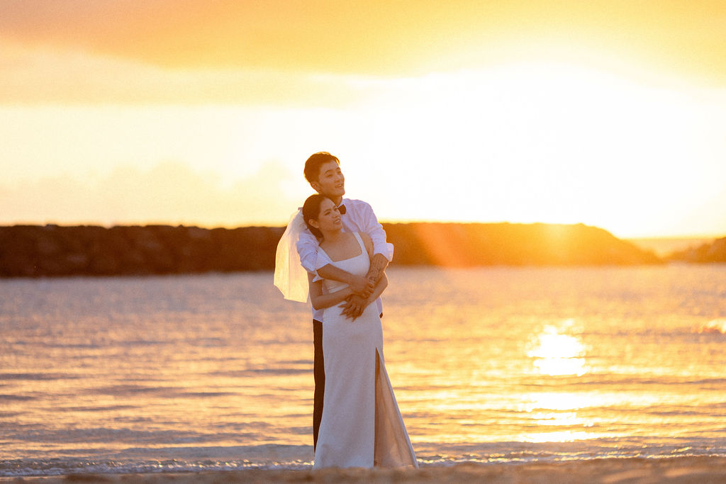 Romantic Oahu sunrise wedding ceremony on Magic Island Beach